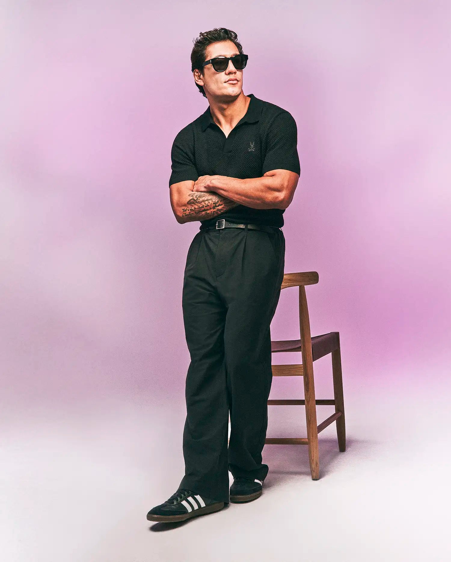 Black Mens Devon Knit Polo, classic fit, featuring a textured knit fabric and a small, tonal embroidered Psycho Bunny skull logo on the left chest.