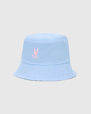 The KIDS MILOS BUCKET REVERSIBLE HAT - B0A550F200 by Psycho Bunny is light blue and embroidered with a pink rabbit head and crossbones logo on the front, displayed against a plain, light gray background.