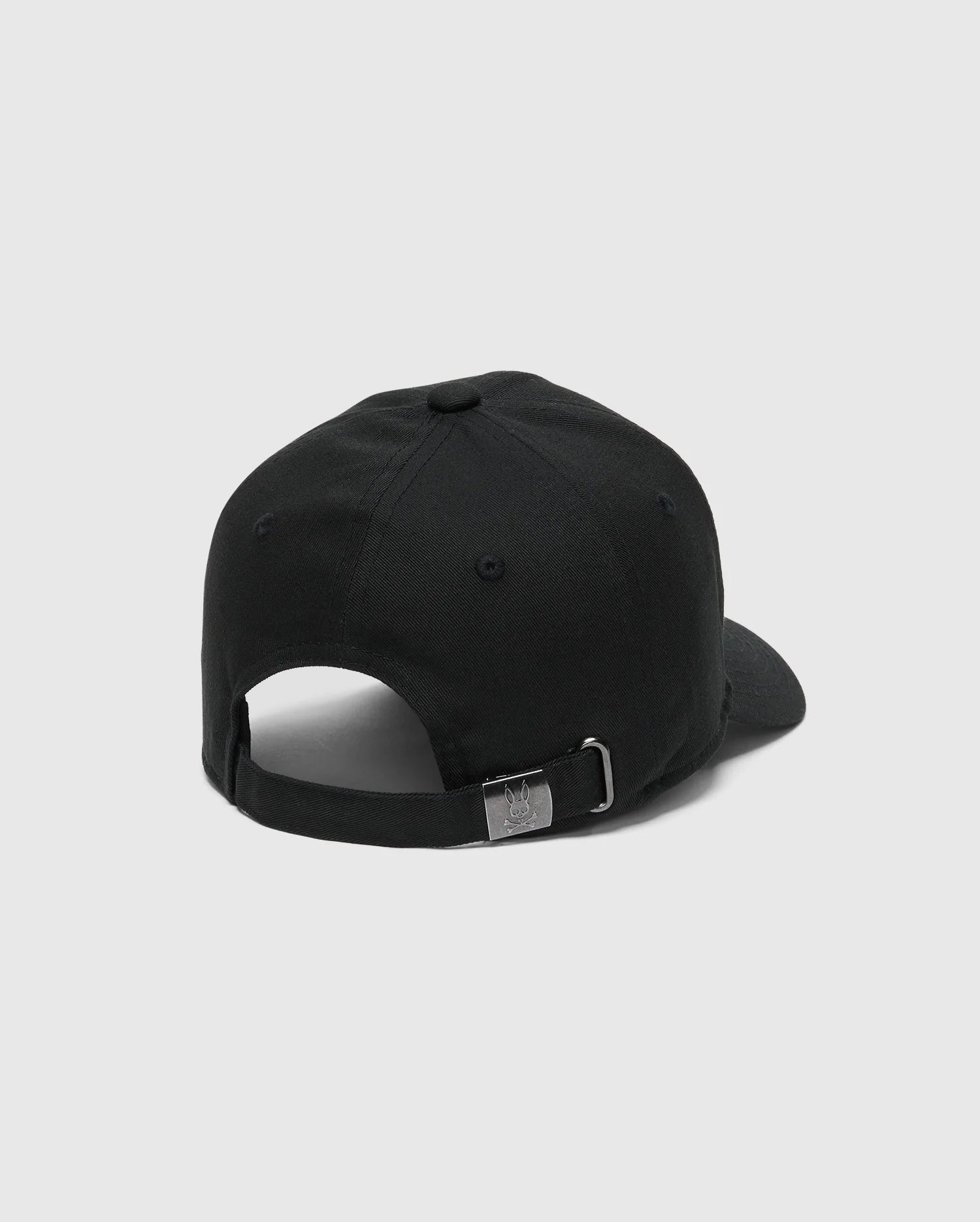 The KIDS CLASSIC BASEBALL CAP - B0A816A1HT by Psycho Bunny features an adjustable fit with a black strap at the back. It includes a metal buckle engraved with the logo and has an embroidered bunny on the front, set against a plain white background.