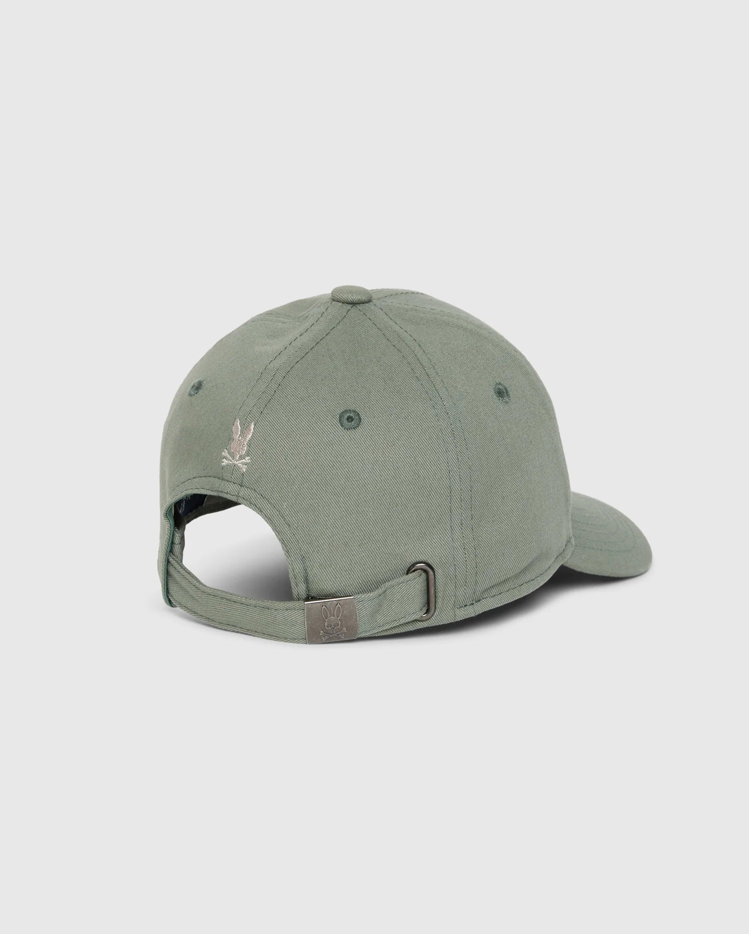A vibrant green KIDS ZACK BASEBALL CAP - B0A886D200 by Psycho Bunny, designed with a sporty feel and made of woven cotton, showcases a small embroidered logo and includes an adjustable strap with a metal buckle, as viewed from the back.