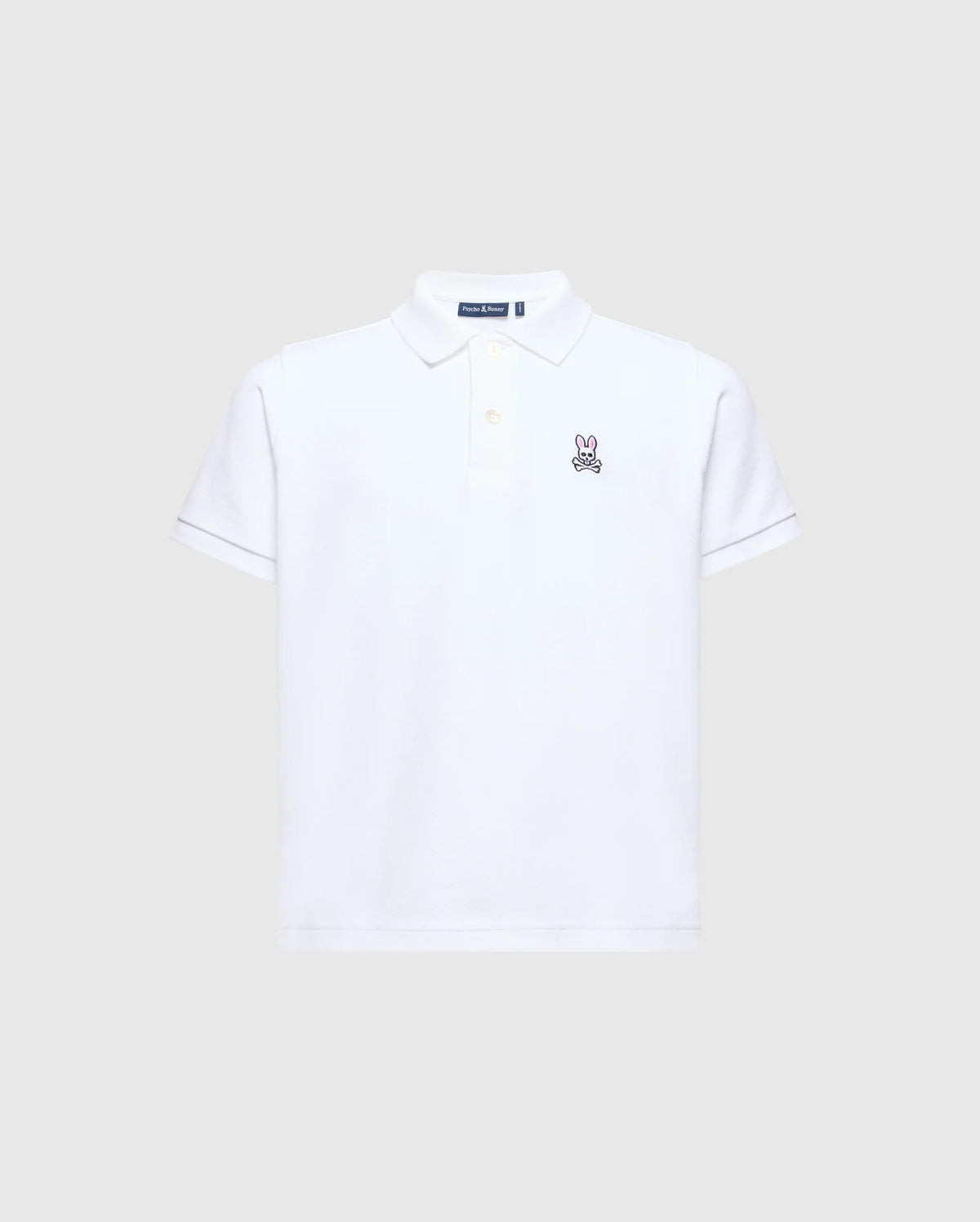 The Psycho Bunny KIDS CLASSIC PIQUE POLO SHIRT - B0K001CRPC is perfect for back-to-school. It features short sleeves, a collar, and an embroidered bunny logo on the left chest against a plain light gray background.