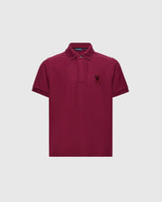 Introducing the KIDS BRANDSON PIQUE POLO - B0K108E200 by Psycho Bunny, a stylish maroon polo shirt for children. Crafted from soft Pima cotton, it showcases a small embroidered emblem on the left chest, complemented by a classic collar and button placket against a plain white backdrop.