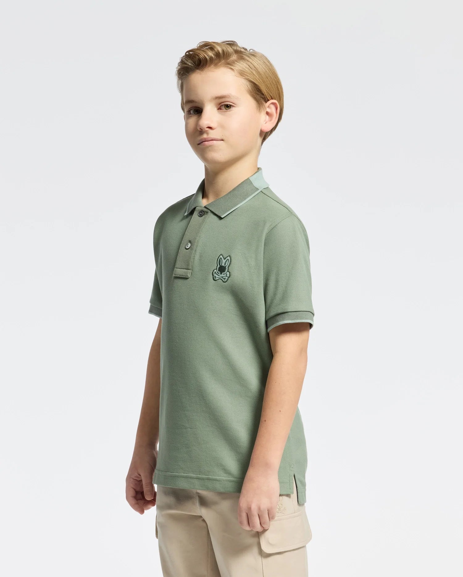 Kids | Kids' New Castle Piqué Polo in green by Psycho Bunny, featuring an embroidered logo and a classic design for a stylish, polished look.