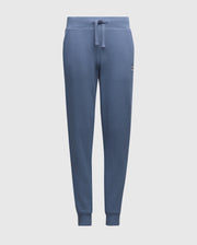 The KIDS LEVY ESSENTIAL FLEECE SWEATPANT - B0P721D200 by Psycho Bunny are blue cotton sweatpants featuring an elastic waistband, drawstring, small logo on the left thigh, tapered legs, and cuffed ankles for comfortable casual wear. They are set against a plain white background.
