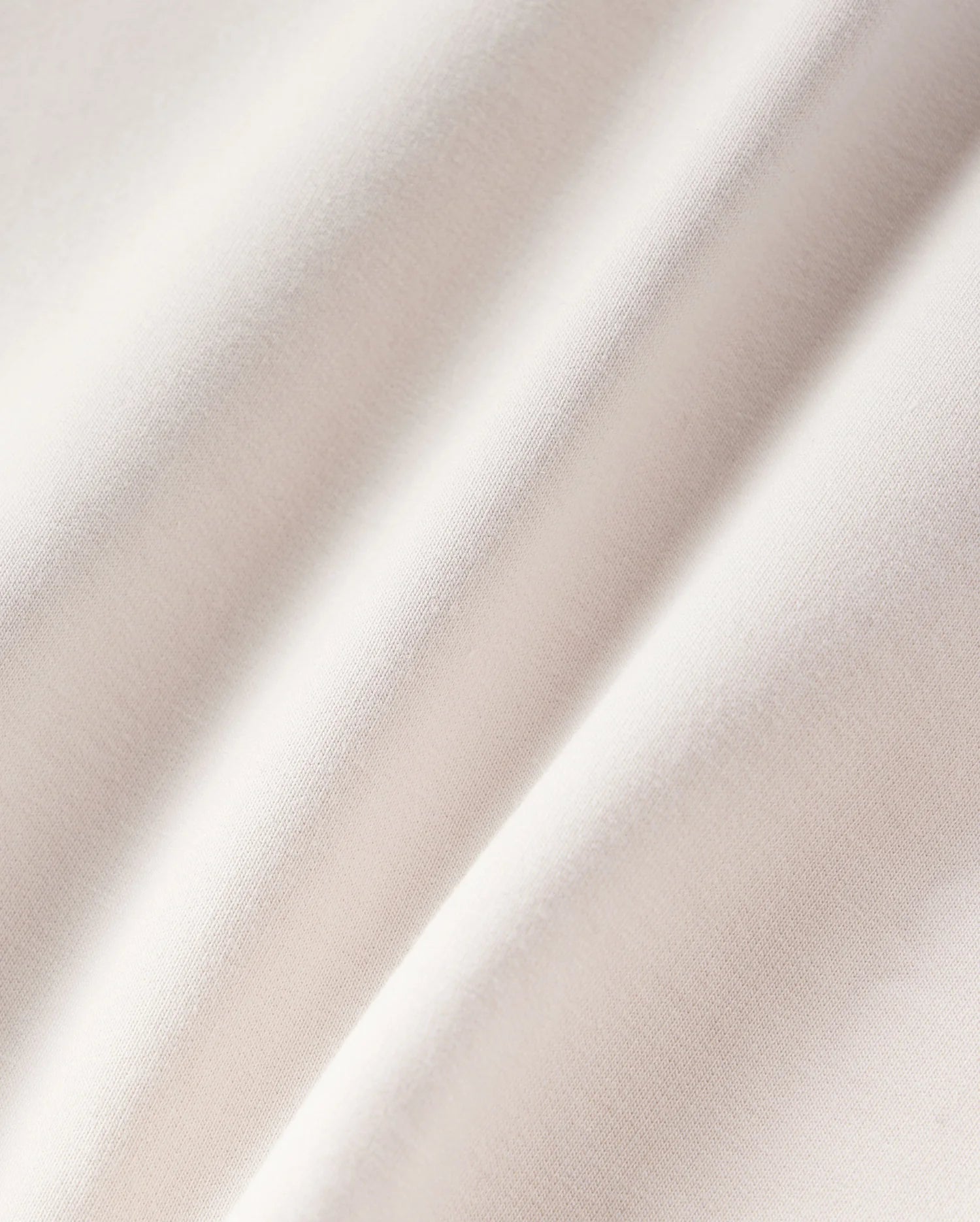 Close-up of soft, gently rippled white satin fabric highlighting its smooth texture and subtle sheen under soft micro French terry lighting Psycho Bunny KIDS LIVINGSTON TERRY SWEATSHORT - B0R408B200.