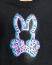 The Psycho Bunny KIDS ANDROS GRAPHIC TEE - B0U525F200, made from 100% Pima Cotton in Peru, features an abstract neon bunny head with crossed bones. Bright pink and blue hues vividly stand out against the dark fabric for a striking look.