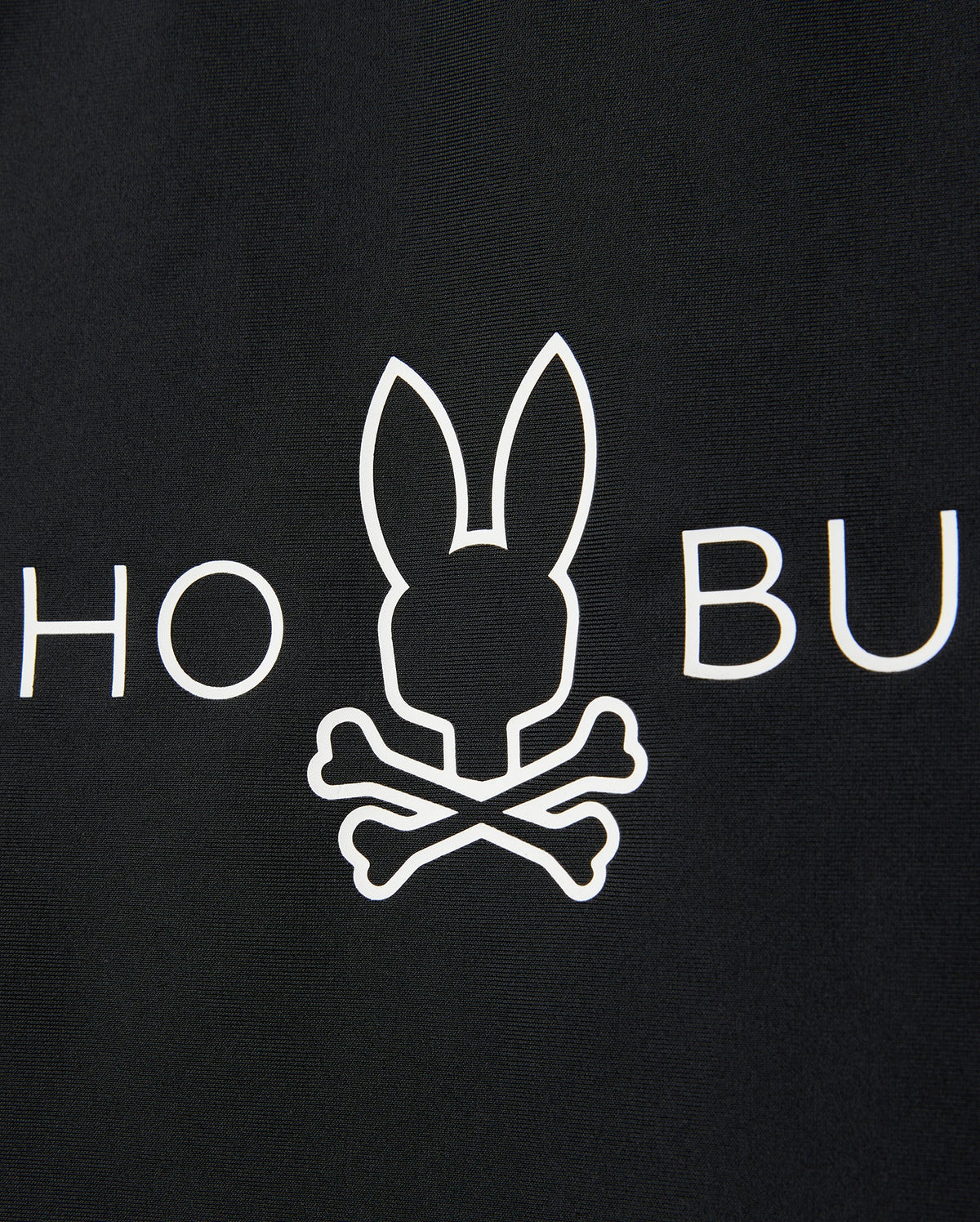 A black background features a white minimalist graphic of a bunny head with crossed bones, mimicking a skull and crossbones. The letters "HO" are partially visible to the left of the bunny, and "BU" to the right. This design is perfect for a Psycho Bunny KIDS SHORT SLEEVE ANTI-UV RASHGUARD - B0U558C200 offering UPF 50+ protection.