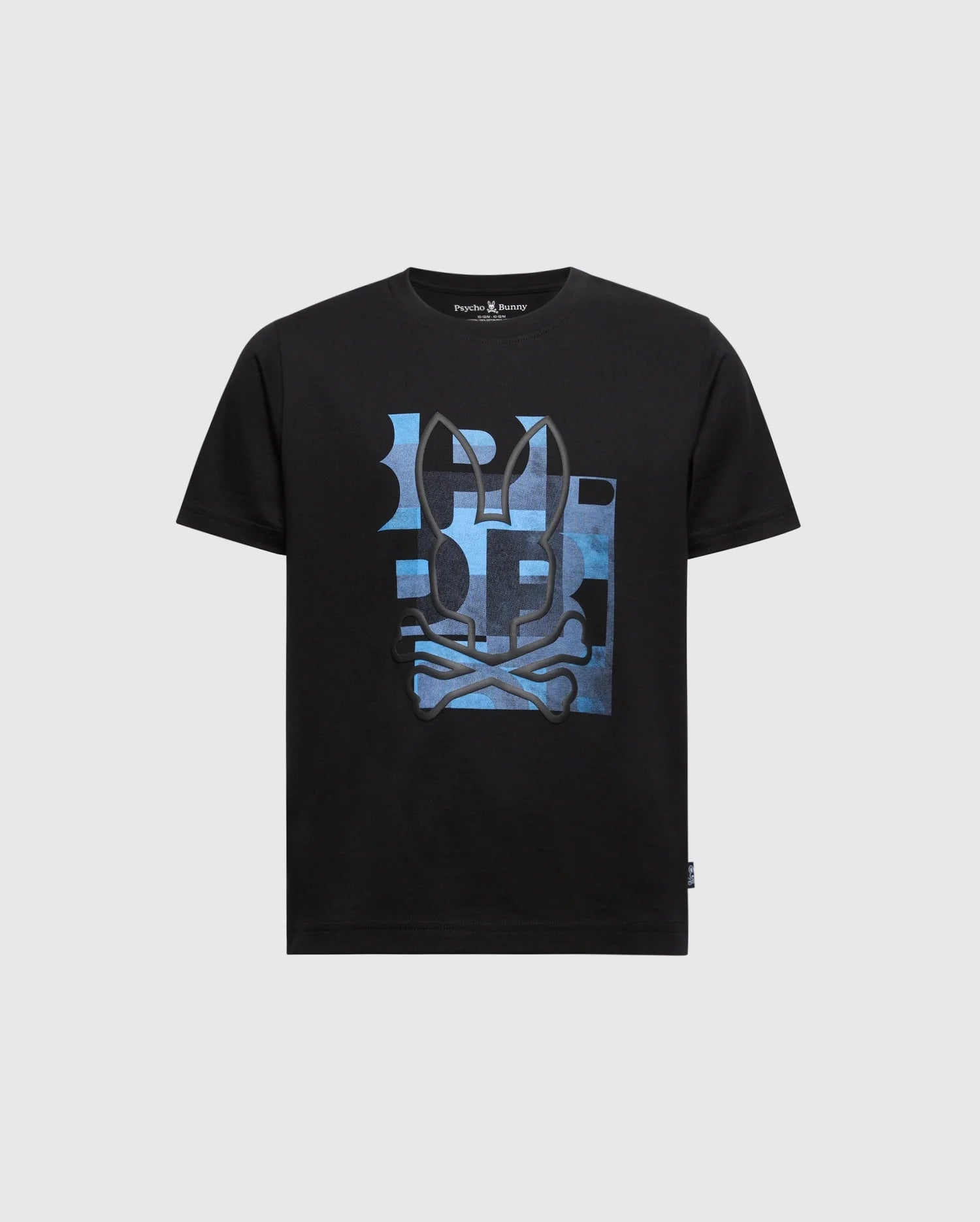 The Psycho Bunny KIDS ZEALAND GRAPHIC TEE, product B0U604F200, is a black Pima cotton kids' shirt featuring a skull and crossbones print with blue abstract shapes and a playful hint of the bunny logo on a light grey background.