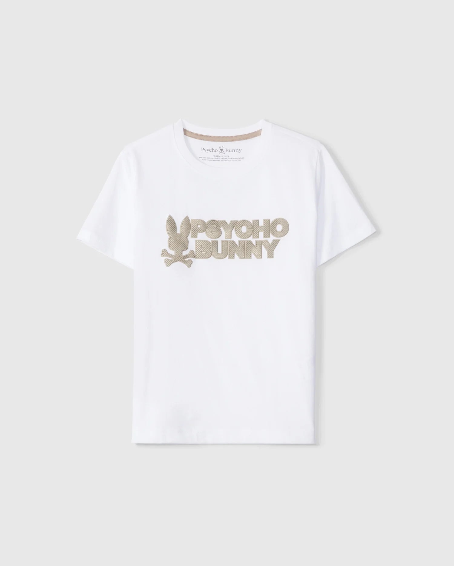 The KIDS MELVIN GRAPHIC TEE - B0U663C200 by Psycho Bunny is a white T-shirt made from Pima cotton, showcasing the text "Psycho Bunny" in large beige letters across the chest. It features a stylized bunny logo with crossed bones underneath, prominently displayed on a plain grey background.