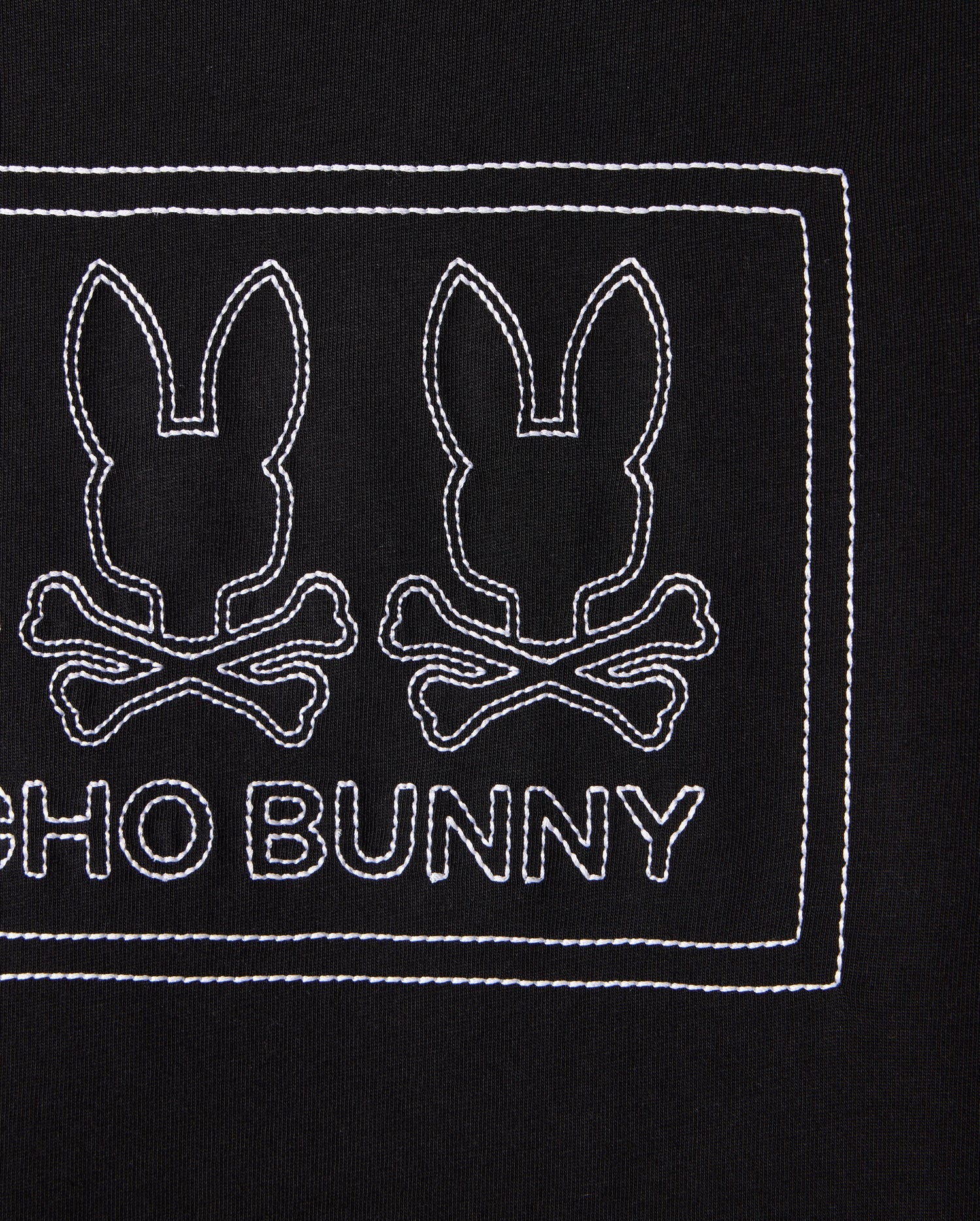 The KIDS TACOMA GRAPHIC TEE - B0U909D200 by Psycho Bunny features two outlined bunny heads with crossbones on a black background, with "PSYCHO BUNNY" embroidered in white below. Made from soft Pima cotton, the design is neatly enclosed within a rectangular stitched border.