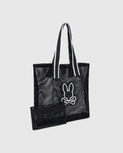 A black Psycho Bunny MENS MESH TOTE BAG - B6A388B200 with logo-webbing straps featuring a white outlined graphic of a rabbit head and crossed bones. Accompanied by a detachable zip pouch in matching black mesh with a zipper. The handles have white inner lining for contrast, set against a plain gray background.