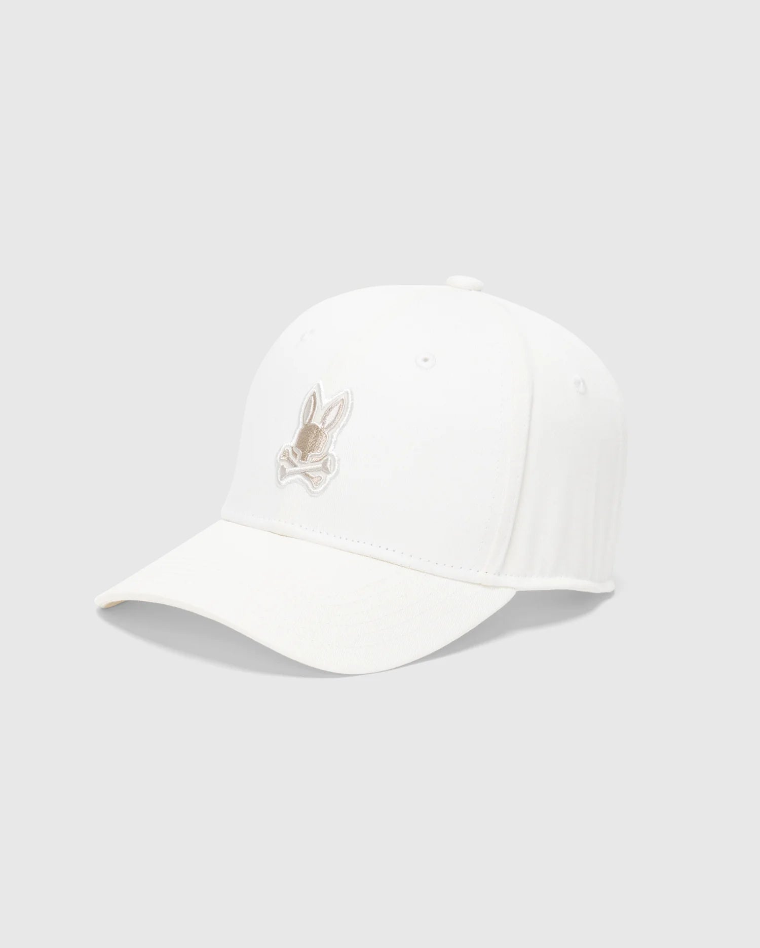 The Psycho Bunny MENS NEW CASTLE GRAPHIC BASEBALL CAP - B6A547F200, with a light brown rabbit embroidered on white cotton twill, exudes quiet luxury. Its slightly curved brim stands out artfully against a plain gray background.