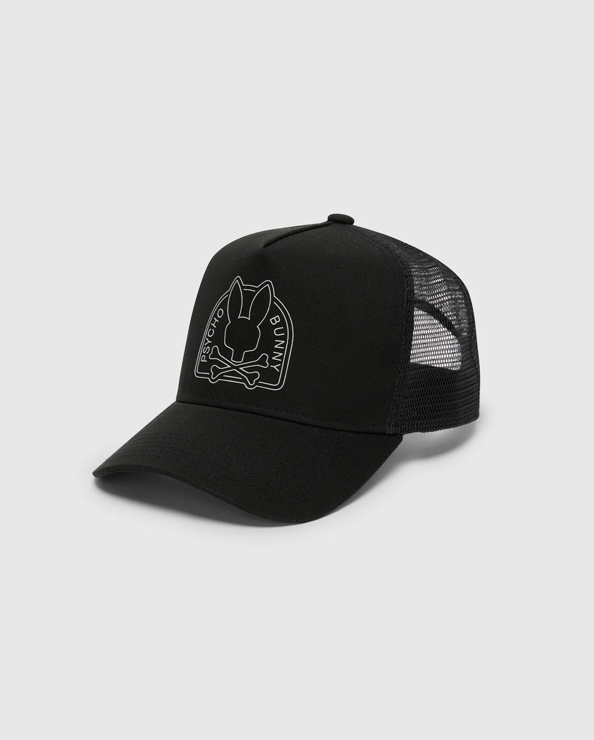 The Psycho Bunny Men's Melbourne Graphic Trucker Hat (B6A548F200) is a black cap featuring a snap-back strap for adjustability, a mesh back, and an embroidered outline bunny logo above crossbones on the front graphic.