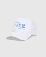 The MEN'S OCEANIA EMBROIDERED GRAPHIC TRUCKER HAT by Psycho Bunny features a streetwear vibe, with blue embroidered bunny graphics and "PSYCHO BUNNY" text on the front. It has a mesh back and an adjustable strap against a plain backdrop.