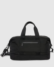A sleek black MENS WEEKENDER BAG - B6A629Z1BG by Psycho Bunny with a front zippered pocket, two sturdy handles, and an adjustable shoulder strap. The bag has a minimalist design, with clean lines and a smooth finish, suitable for travel or gym use.