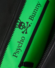 Close-up image of a zippered pocket inside the MENS WEEKENDER BAG - B6A629Z1BG with a bright green lining. The lining features the text "Psycho Bunny" in black letters along with a black logo of a bunny skull and crossbones.