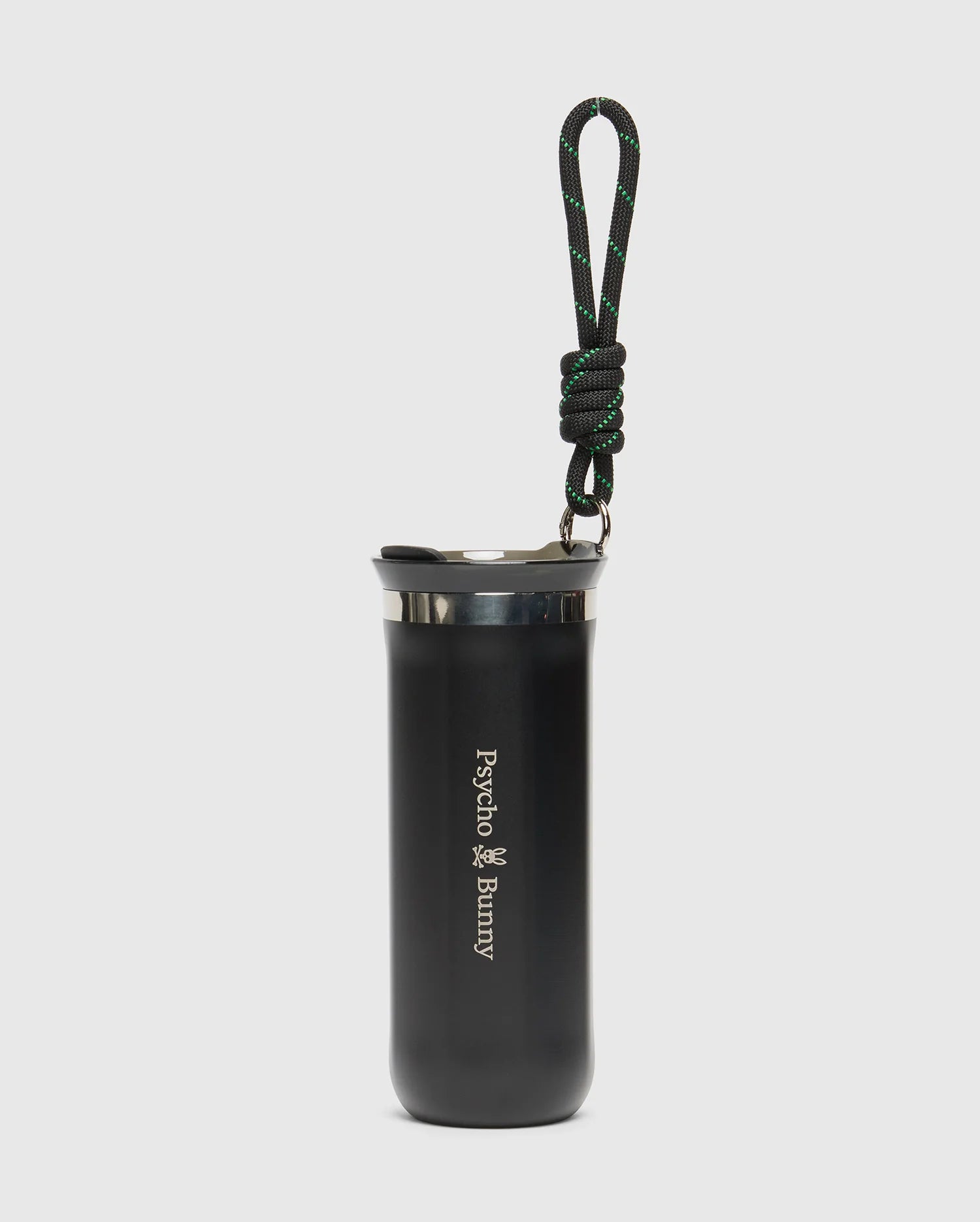 The Psycho Bunny MENS TRAVEL COFFEE MUG (B6A634F200) is an eco-friendly black stainless steel tumbler with a lid, featuring the iconic logo. It includes a black and green looped carabiner handle on top, set against a plain white background, perfect for hydration on the go.