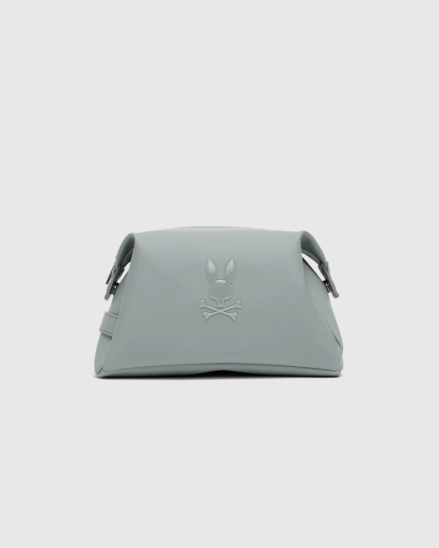 The MENS TOILETRY KIT - B6A636F200 by Psycho Bunny, with its subtle rabbit and crossbones logo, structured shape, curved fold-over top, and metallic fastenings, is perfect for keeping essentials organized for anyone on the go.