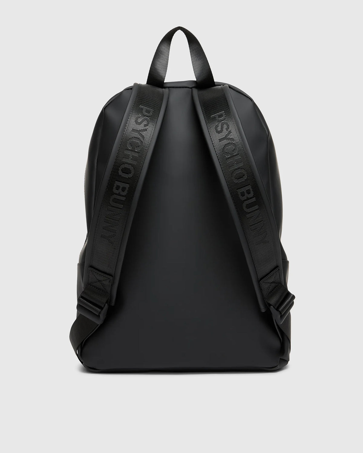 The MENS RUBBERIZED BACKPACK - B6A637F200 by Psycho Bunny is a sleek black accessory with embossed shoulder straps, minimalistic design, and smooth finish. It features simple black handles against a light gray background.