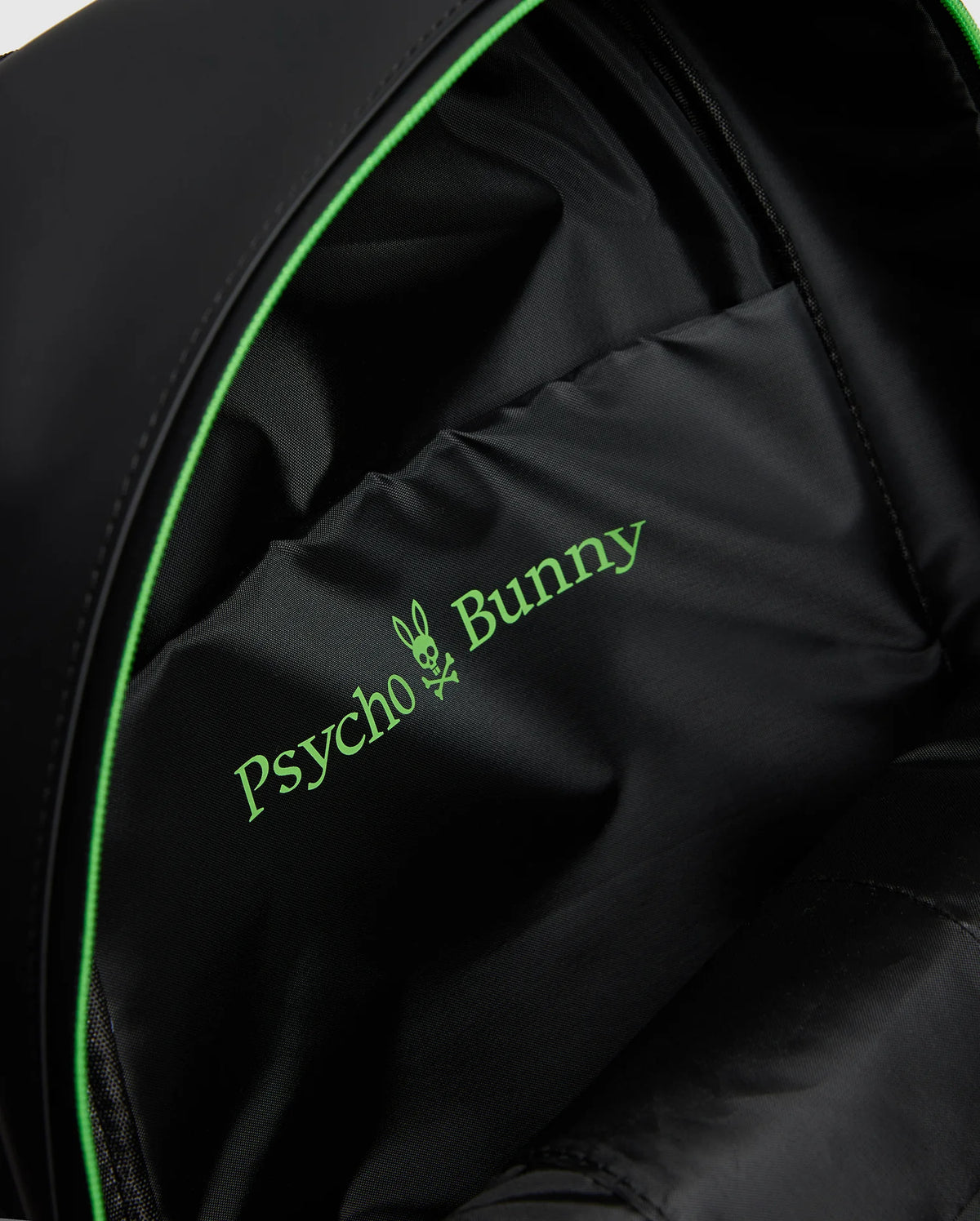 Close-up of the black MENS RUBBERIZED BACKPACK (B6A637F200) interior by Psycho Bunny, featuring a green bunny crossbones logo, showcasing its durable and functional design with robust lining and precise stitching.