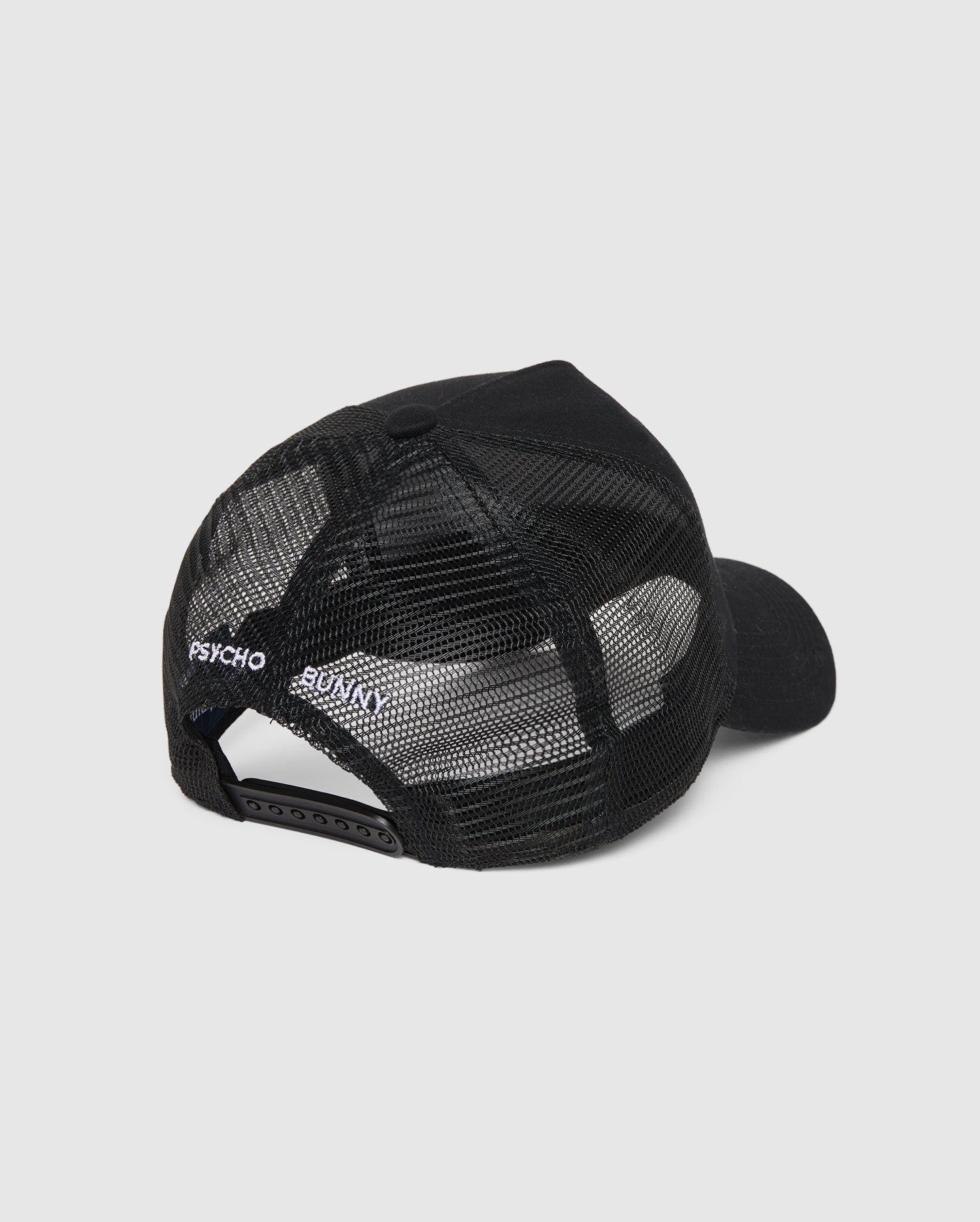 Psycho Bunny MENS BUNNY PATCH TRUCKER HAT - B6A965Y1HT with a mesh back and "PSYCHO BUNNY" patch logo on the side, photographed on a white background.