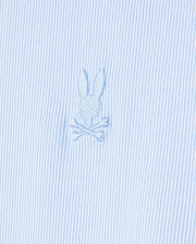 Close-up of the Psycho Bunny men's Brook striped jersey shirt in light blue and white, made from soft Pima cotton and featuring an embroidered emblem of a bunny head above crossed bones.