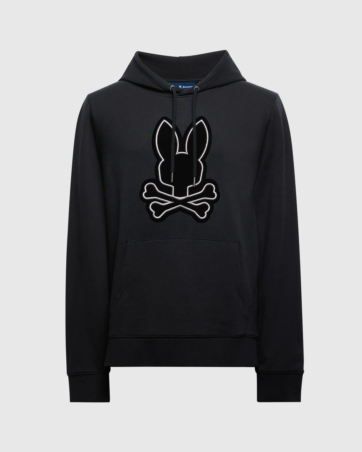 The MENS ALEXANDER HOODIE - B6H154E200 from Psycho Bunny is crafted for comfort, featuring a kangaroo pocket and adorned with a stylized bunny head and crossbones graphic on the front.