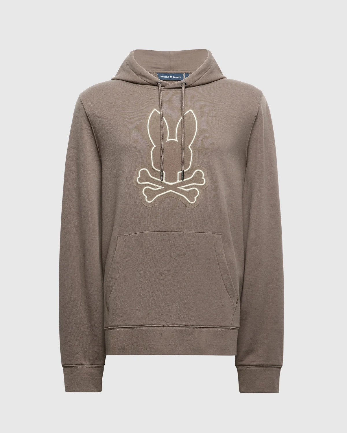 The Psycho Bunny MENS ALEXANDER HOODIE - B6H154E200 is a comfortable men's cotton blend pullover hoodie available in brown. It includes a kangaroo pocket and a hood, featuring a stylized design of bunny ears above crossed bones on the chest.
