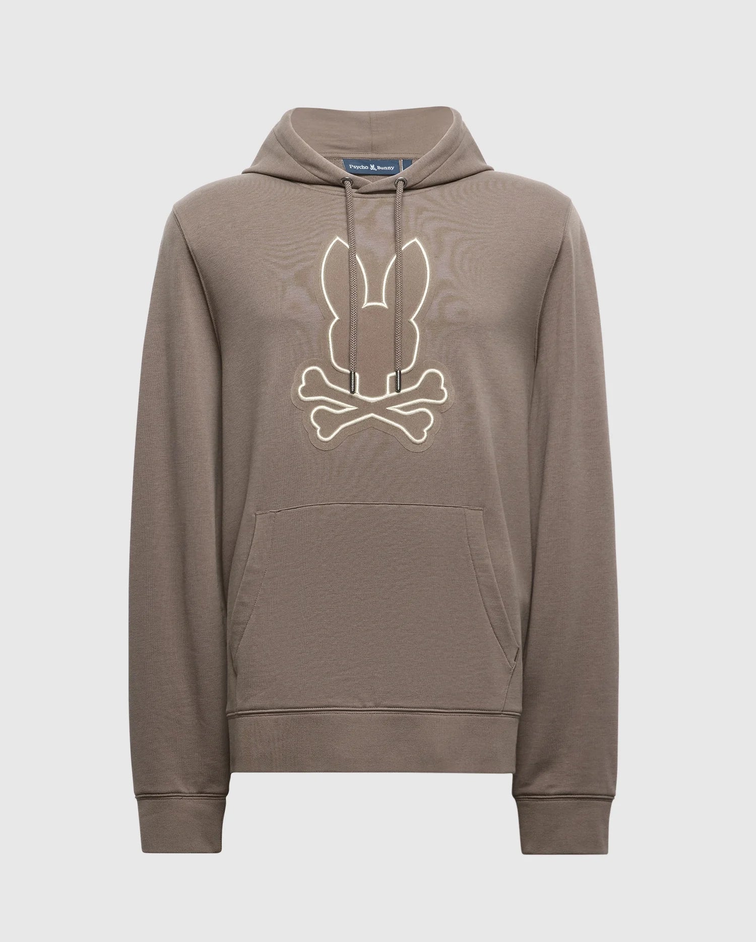 The Psycho Bunny MENS ALEXANDER HOODIE - B6H154E200 is a comfortable men's cotton blend pullover hoodie available in brown. It includes a kangaroo pocket and a hood, featuring a stylized design of bunny ears above crossed bones on the chest.
