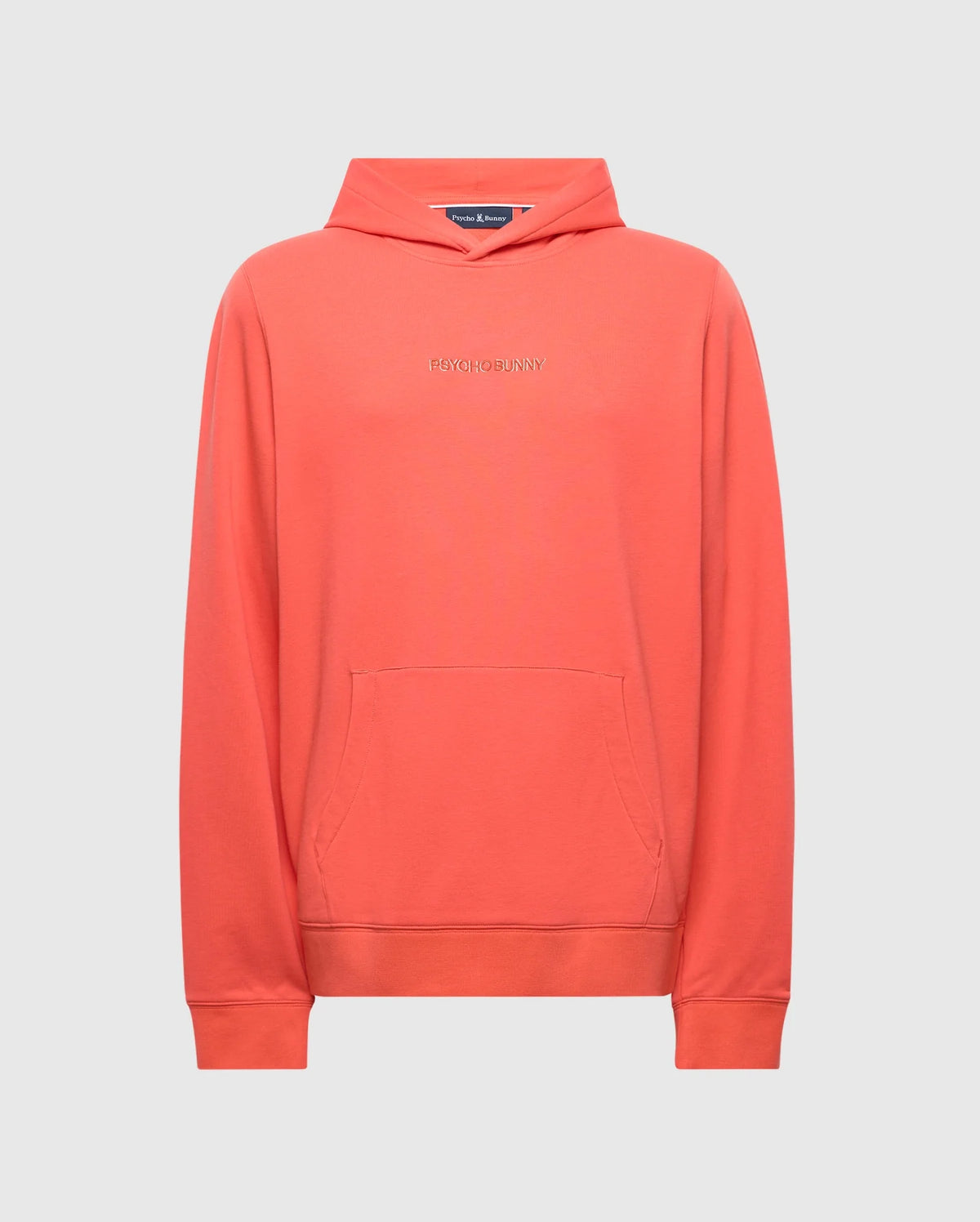 The Psycho Bunny Men's Nora Classic French Terry Hoodie (B6H434F200) in coral features a front pocket, long sleeves, and a subtle chest wordmark. Displayed on a light gray background, this hoodie is a stylishly minimalist wardrobe addition.
