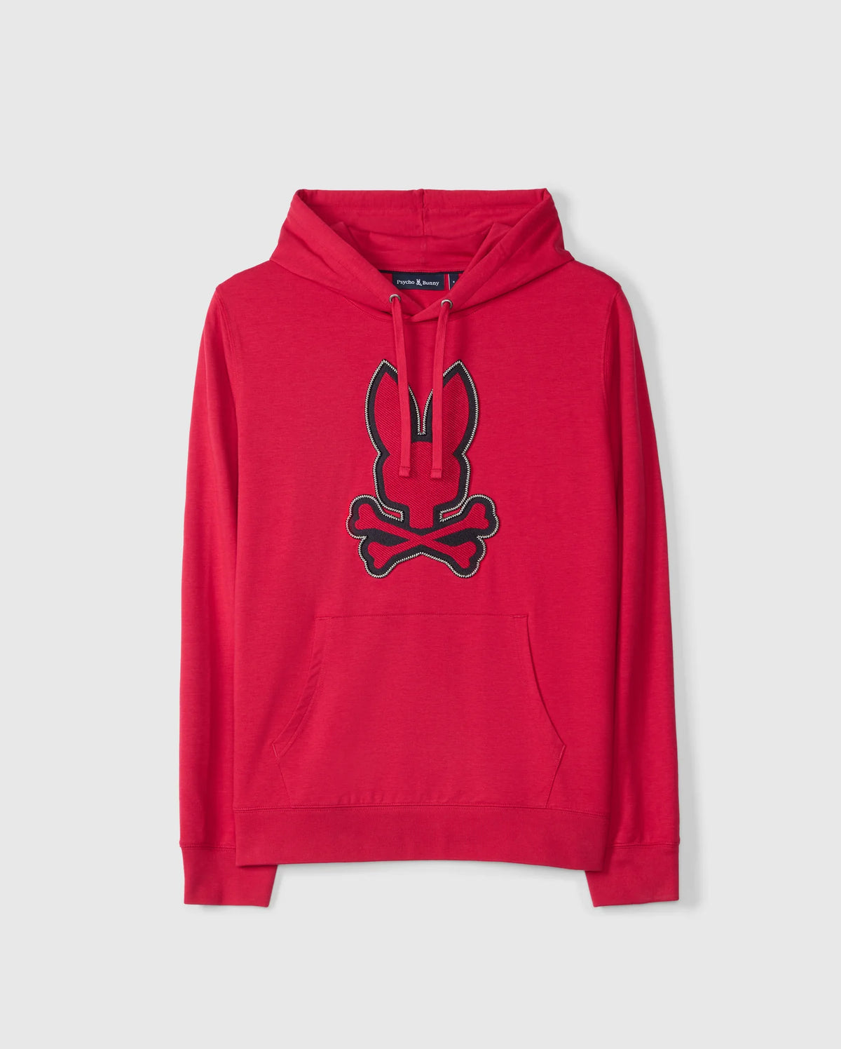 The MENS WALTER LIGHTWEIGHT HOODIE by Psycho Bunny features a French terry material with a red hood. It showcases a 3D outlined embroidery of the black bunny logo with crossed bones on the front, set against a plain background.