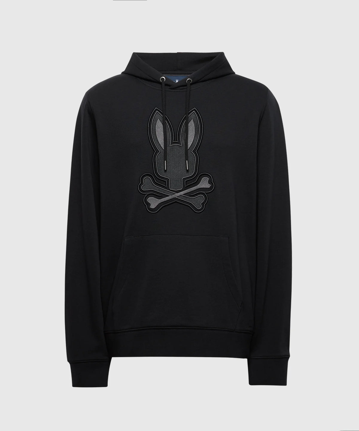 The MENS NEW CASTLE FRENCH TERRY HOODIE by Psycho Bunny showcases a unique bunny face and crossbones design on the front. Crafted from soft French terry, this elegant black hoodie features a drawstring hood and a front kangaroo pocket for comfort and style.