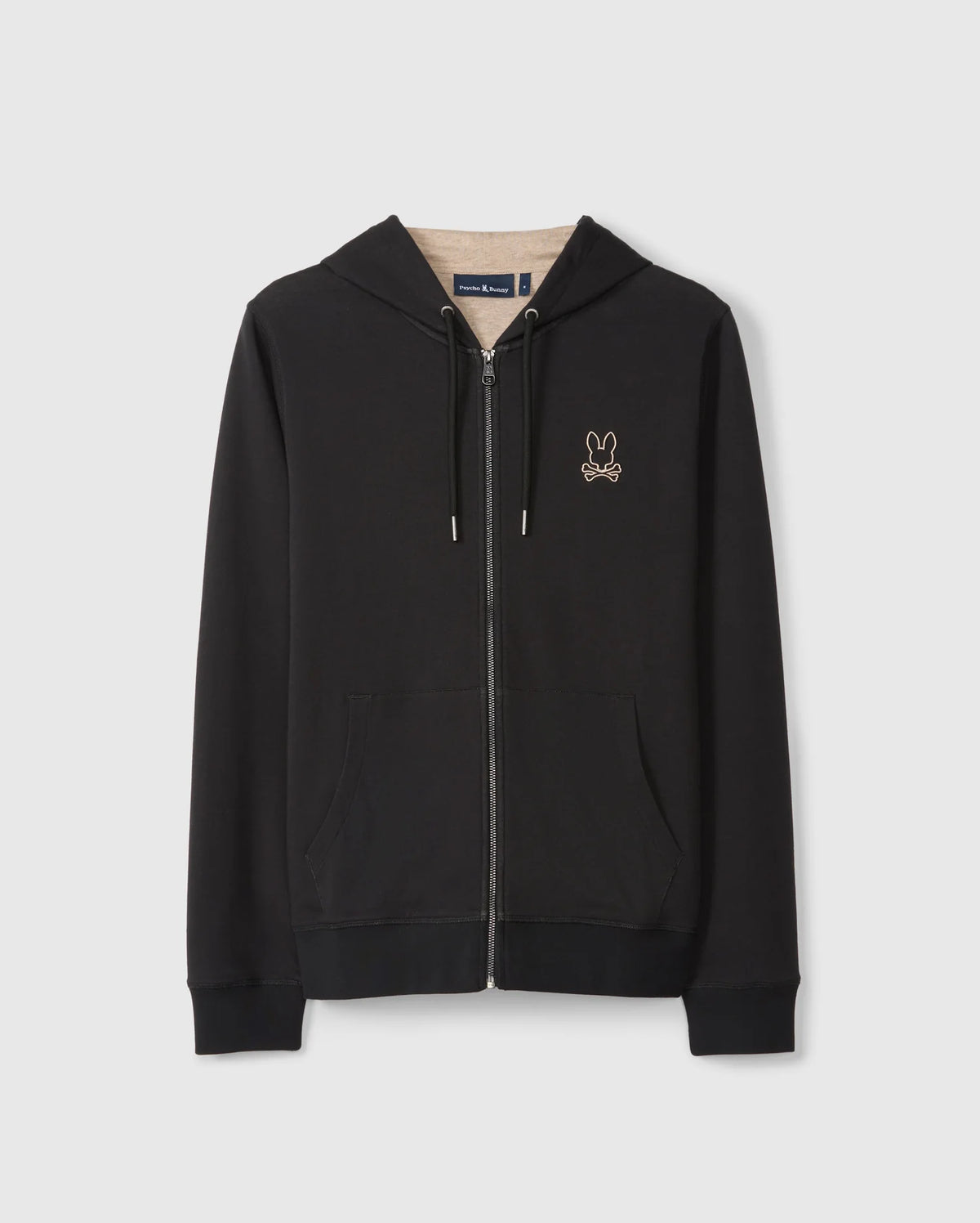 The MENS JAMES PREMIUM ZIP HOODIE - B6H793D200 by Psycho Bunny features a small embroidered Bunny graphic on the left chest, with crossed bones below it. Made from double-faced premium jersey, it includes front pockets, a drawstring hood, and ribbed cuffs and hem. Displayed against a plain white background.