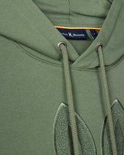 Close-up of the Psycho Bunny MENS PACIFIC CHENILLE HOODIE - B6H930D200 in green with drawstrings, showcasing a label and stitched detailing. Crafted from soft French terry, it features exquisite chenille embroidery for added texture.