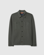 Introducing the MENS BEDFORD SHIRT JACKET - B6J290B200 by Psycho Bunny: a dark green shirt jacket made from a cotton-blend fabric. It includes a collar, two chest pockets, and two side pockets. Its understated design offers a casual and urban look, beautifully showcased against a plain background.