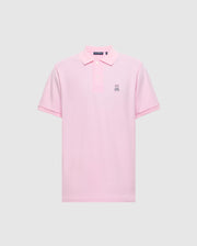 The Psycho Bunny Men's Classic Pique Polo Shirt - B6K001CRPC, is a pink polo made from soft Pima cotton. It features a small embroidered rabbit logo on the left chest, a classic collar, and a button placket against a plain light gray background.