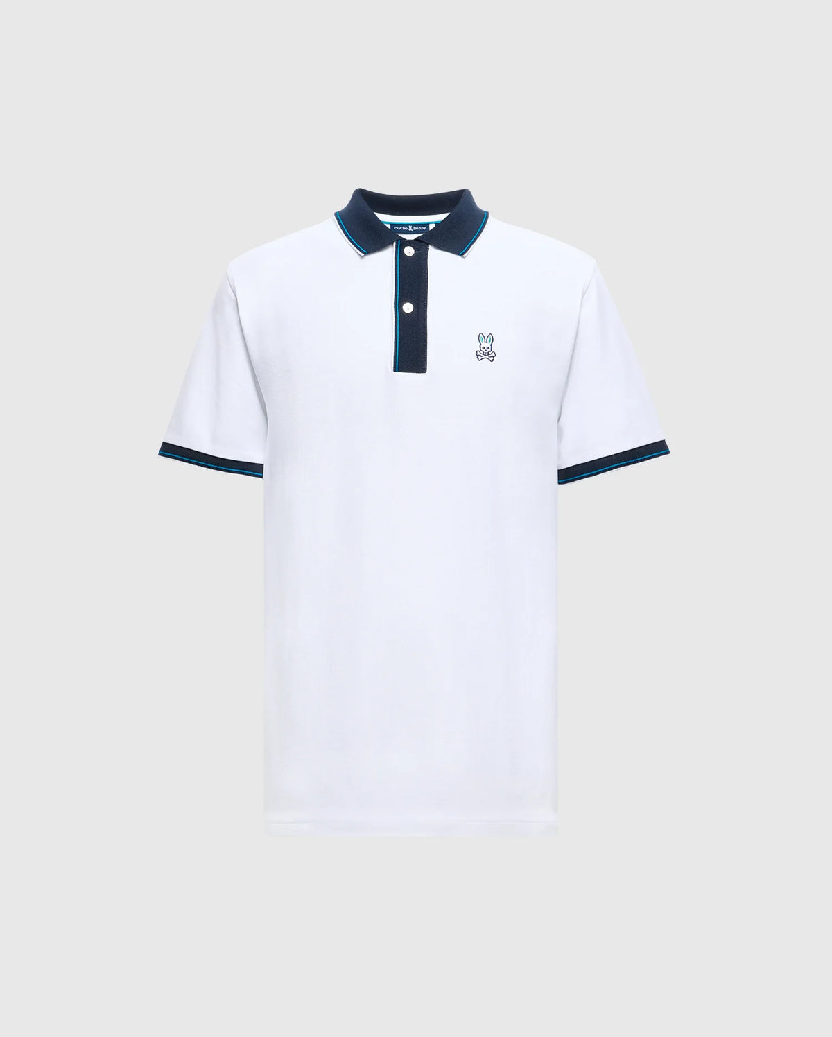 Introducing the Psycho Bunny Men's Brandon Pique Polo - B6K280E200, a luxurious white shirt with a dark collar and sleeve trim. It features a small embroidered logo of a cartoon bunny on the left chest. Designed for both comfort and style, this premium quality polo effortlessly enhances any wardrobe.