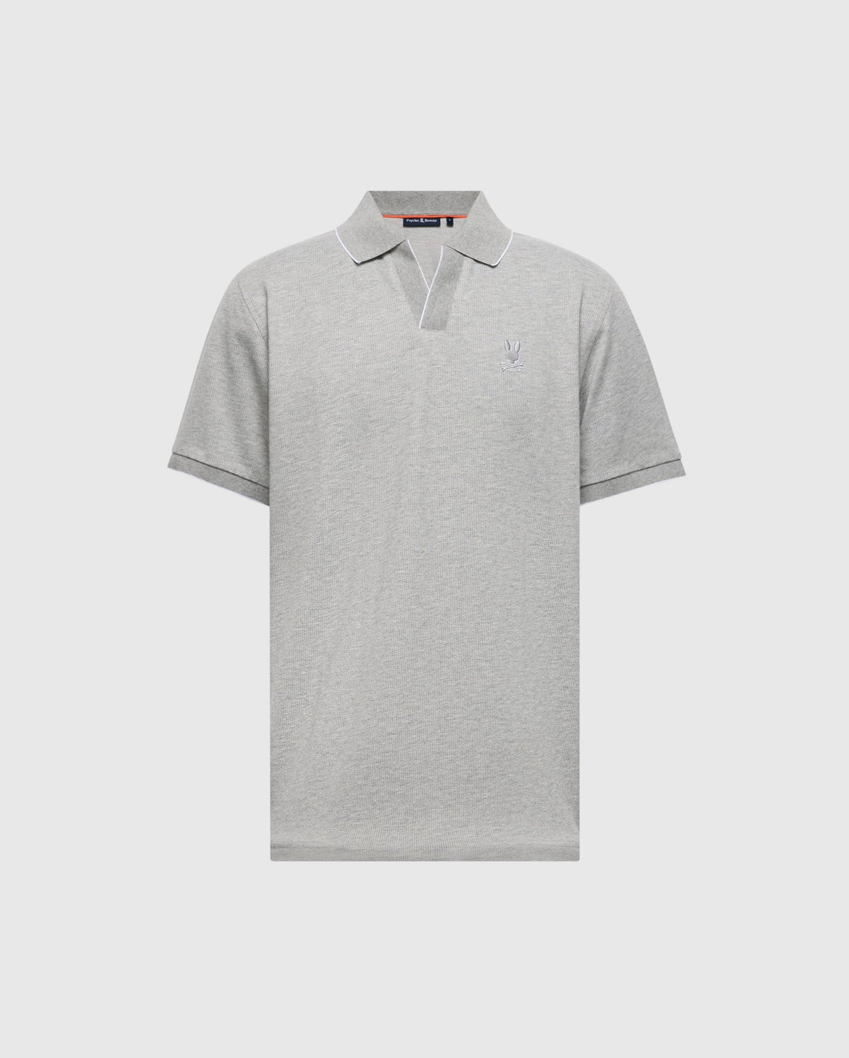 The Psycho Bunny MENS MACKAY JACQUARD JOHNNY COLLAR POLO, B6K408F200, is a light gray polo with mini jacquard fabric. It features short sleeves, a subtle chest logo, a classic Johnny collar, and a V-notch neckline against an off-white background.