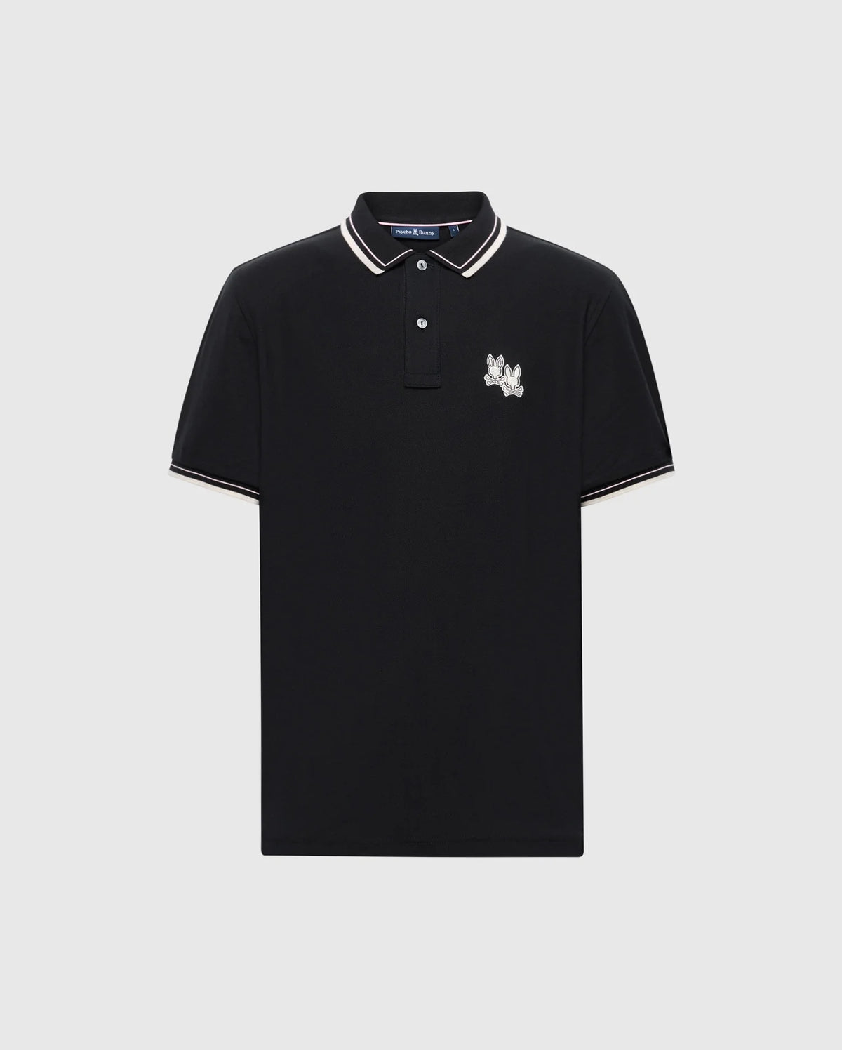 Discover Psycho Bunny's MENS ELLIOT PIQUE POLO in black Pima cotton, featuring white and beige trim on the collar and sleeves. It boasts an embroidered bunny design on the left chest and a classic two-button placket for timeless style.
