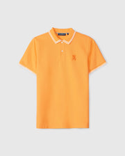 An orange short-sleeve Psycho Bunny MENS BELTON PIQUE POLO - B6K575C200 featuring white trim on the collar and sleeves. The shirt has a two-button placket and an embroidered Bunny logo on the left chest, crafted from soft Pima cotton. The shirt is displayed on a plain white background.