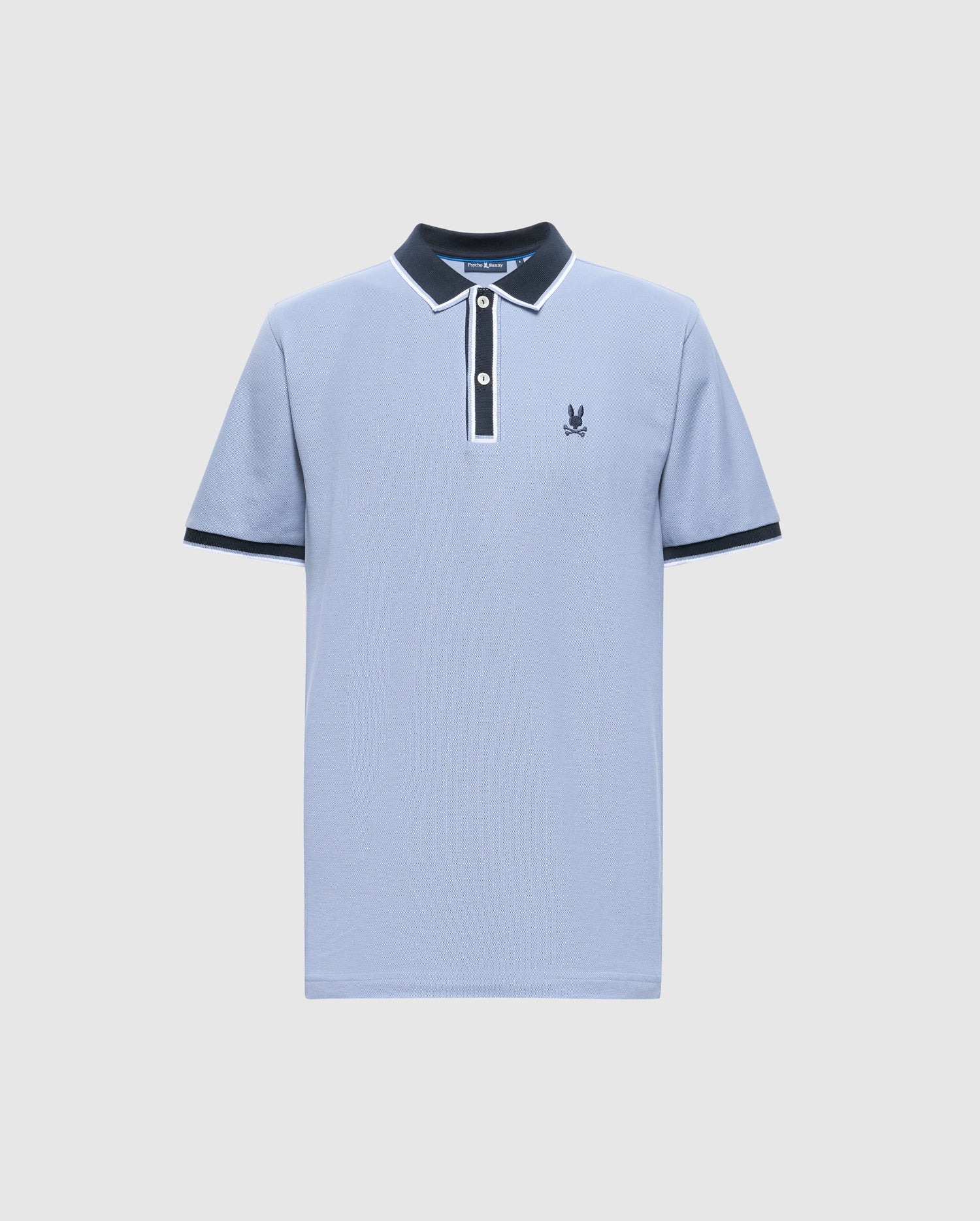 The Psycho Bunny MENS KENT PIQUE POLO - B6K951D200 is a premium men's polo shirt in light blue, featuring a navy collar and cuffs, a white button placket, and an embroidered logo on the left chest. Crafted from fine materials, it showcases delicate white trim on the collar and sleeves for added elegance.