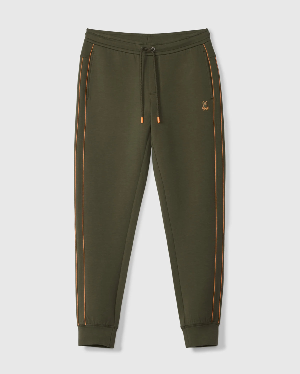The MENS TRAVIS TRACK PANT - B6P143D200 by Psycho Bunny is crafted from a high-quality cotton blend in an olive green hue, featuring distinctive orange piping along the sides. These pants come with an elastic waistband complete with a drawstring, side invisible zip pockets, and cuffed ankles for added comfort and style. A small embroidered logo adorns the left thigh. Displayed against a plain white background.