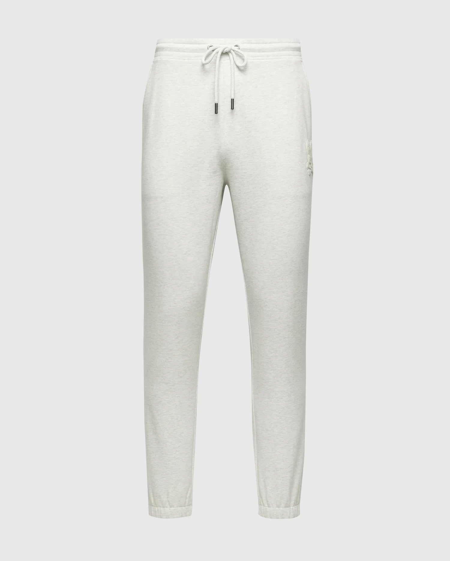 The MENS ELDORADO BRUSH BACK JOGGER - B6P285E200 by Psycho Bunny features a light gray color and the Chenille Bunny logo. These joggers have an adjustable drawstring waistband, two side pockets, and elasticized ankle cuffs. Made from soft brushback cotton for comfort.
