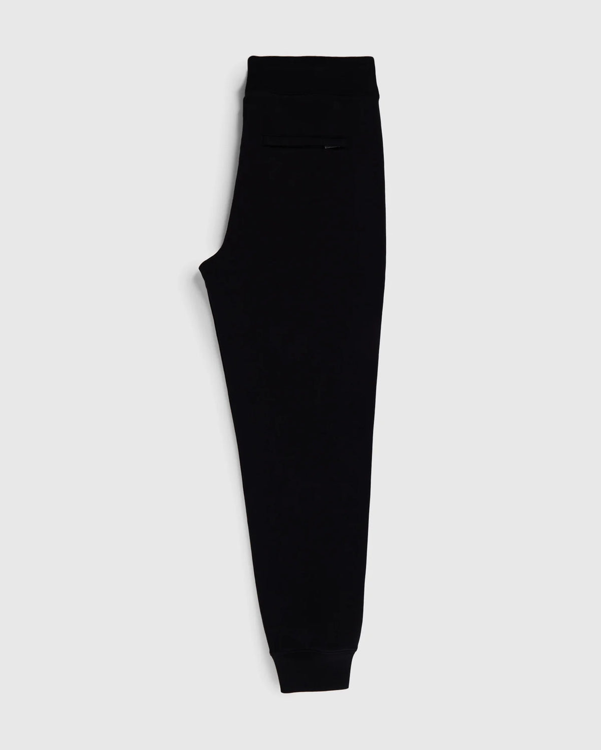 A pair of Psycho Bunny MENS SANTA CRUZ SWEATPANT - B6P843A2FT in sleek black, with an elastic waistband and cuffs, displayed on a plain white background. Made from 100% cotton for ultimate comfort and style, these sweatpants feature a minimalist design and a small pocket on the side near the waistband.