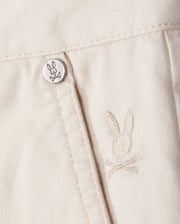 A button on a white shirt, perfect for pairing with Psycho Bunny's MENS YORK CHINO SHORT - B6R357B200.