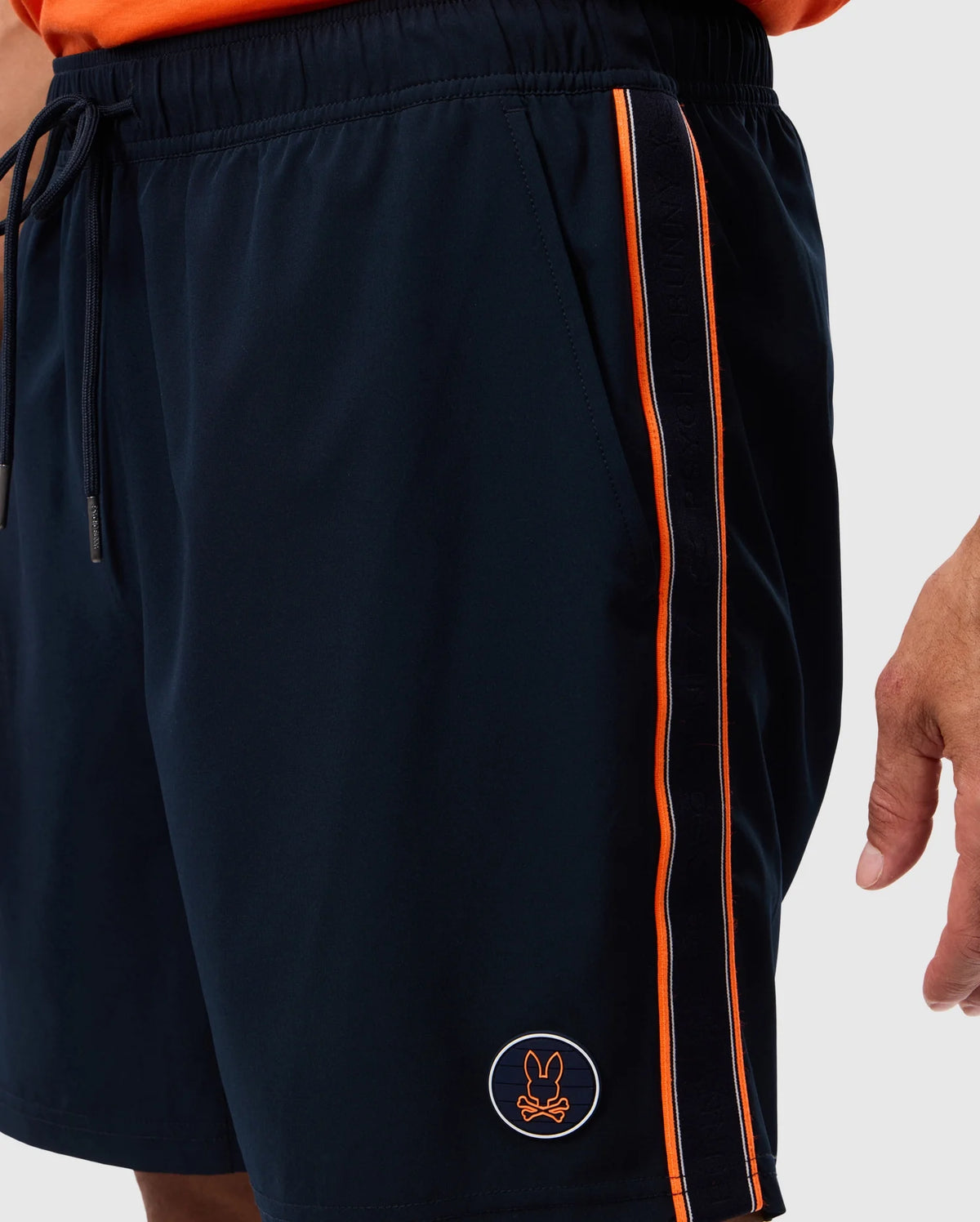 A close-up of a man's MENS SONTERRA STRIPE SPORT SHORT - B6R464C200 by Psycho Bunny, crafted from stretch fabric.