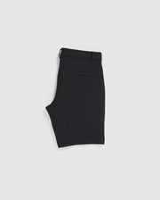 A pair of neatly folded Psycho Bunny MENS GABLE REGULAR FIT SPORT SHORT - B6R761ARCN made from a smooth, durable stretch cotton-nylon fabric is displayed on a plain white background. The black shorts feature belt loops, a hidden zip pocket, and a single welt pocket on the back.
