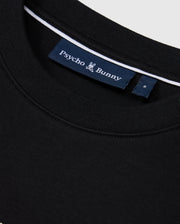 Close-up of the MENS TACOMA MODAL SWEATSHIRT by Psycho Bunny in black, boasting a durable design with a "Psycho Bunny" label on the inside near the collar. The navy blue label features white text and a small bunny logo, providing luxurious comfort with its premium craftsmanship.