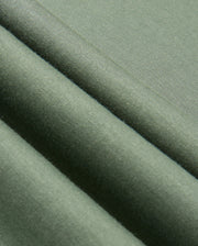 Close-up of the Psycho Bunny MENS TACOMA SWEATSHIRT - B6S927D200 in green fabric, showcasing its soft texture and gentle folds. The lightweight material appears smooth and has a subtle sheen, indicating a fine weave.