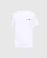 The MENS LONGMONT GRAPHIC TEE - B6U194E200 from Psycho Bunny showcases the iconic logo and name on the chest, beautifully highlighted against a plain gray backdrop. Made with premium Pima Cotton, this white T-shirt provides exceptional comfort, making it perfect for any casual men's wardrobe.